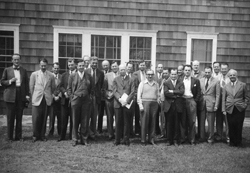 Some attendees of the Shelter Island Conference on Low Temperature Physics. Darrow is in the first row, holding a file. Some of the other attendees (location unidentified) are: Donald H. Andrews, Henry A. Boorse, J.G. Daunt, C.T. Lane, Fritz London, Duncan A. MacInnes, John C. Slater, Laszlo Tisza, Henry C. Torrey in 1948.